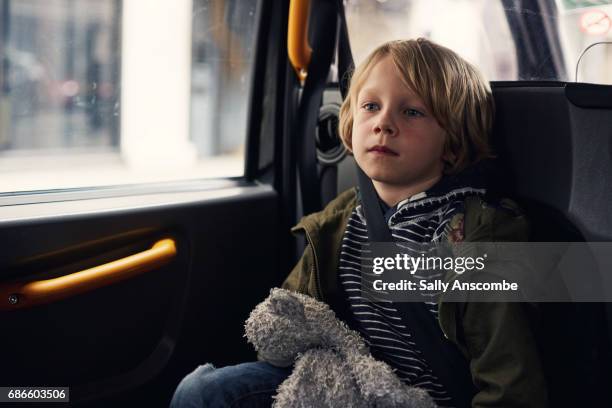 child sat in a car - taxi boys stock pictures, royalty-free photos & images