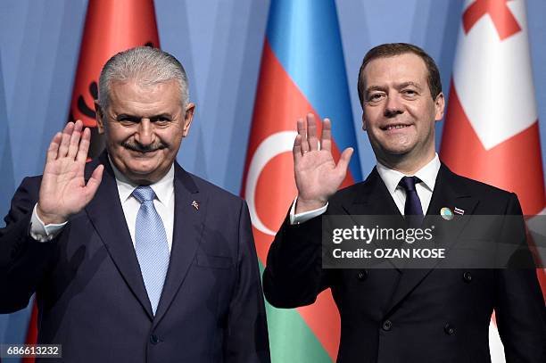 Turkish Prime Minister Binali Yildirim and Russia Prime Minister Dmitry Medvedev pose for a family picture during the summit of Organisation of Black...