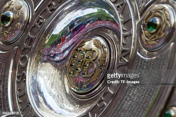 The German Championship trophy is displayed prior the Bundesliga match between Bayern Muenchen and SC Freiburg at Allianz Arena on May 20, 2017 in...