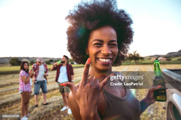 young friends enjoying the freedom on a car trip over a country offroad - festival selfie stock pictures, royalty-free photos & images