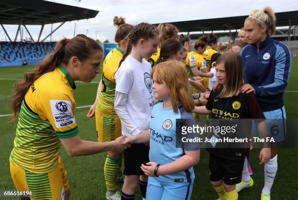 Annie Heatherson of Yeovil Town Ladies shakes a mascots hand before the WSL Spring Series Match between Manchester City Women and Yeovil Town Ladies...