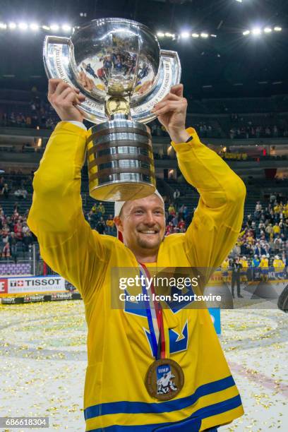 Anton Stralman celebrates with the trophy during the Ice Hockey World Championship Gold medal game between Canada and Sweden at Lanxess Arena in...
