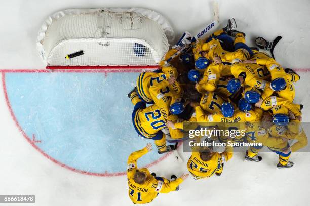 Team Sweden celebrates the win over Canada during the Ice Hockey World Championship Gold medal game between Canada and Sweden at Lanxess Arena in...