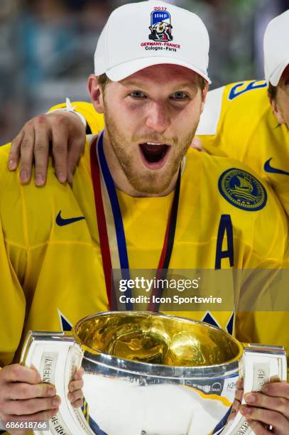 Gabriel Landeskog celebrates with the trophy during the Ice Hockey World Championship Gold medal game between Canada and Sweden at Lanxess Arena in...