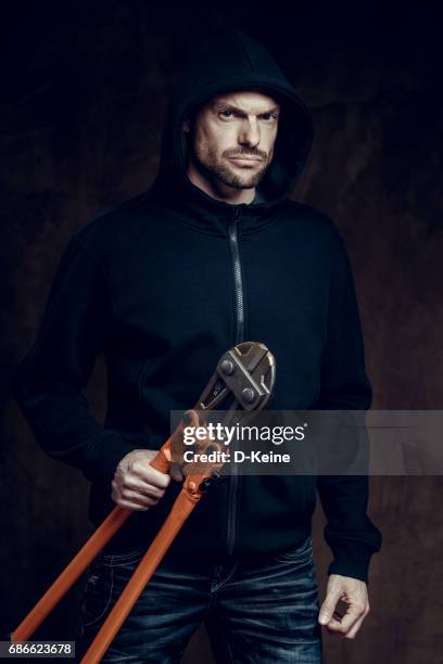 thief - bolt cutter stock pictures, royalty-free photos & images