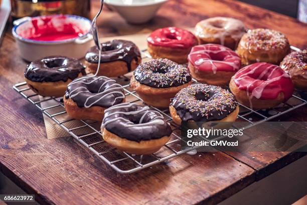 preparing homemade donuts - glazed food stock pictures, royalty-free photos & images