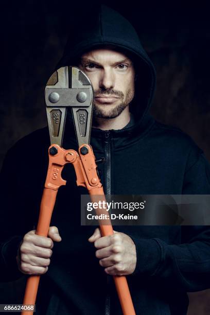 thief - bolt cutter stock pictures, royalty-free photos & images