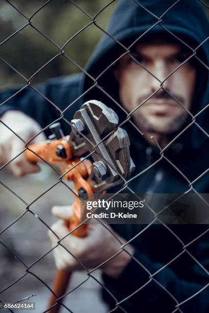 thief - bolt cutter stock pictures, royalty-free photos & images