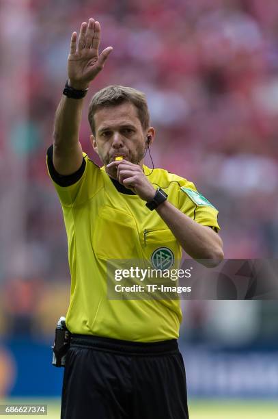 Referee Dr. Jochen Drees gestures during the Bundesliga match between Bayern Muenchen and SC Freiburg at Allianz Arena on May 20, 2017 in Munich,...