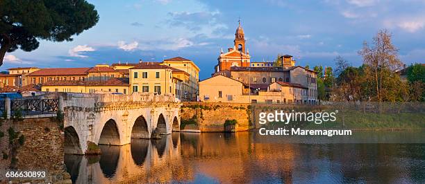 tiberio bridge and the town - rimini stock pictures, royalty-free photos & images