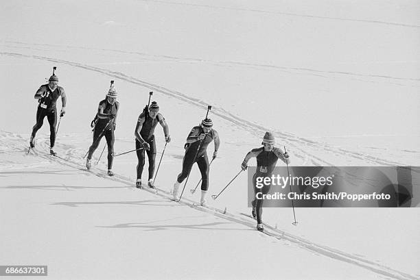 View of a team competing in the Relay Biathlon event at the 1980 Winter Olympics at Lake Placid Olympic Sports Complex Cross Country Biathlon Center...