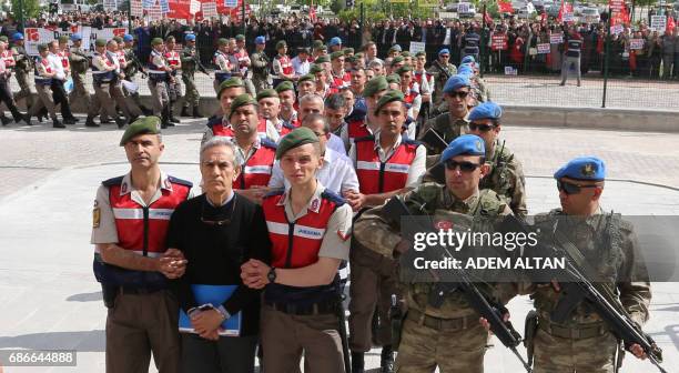 Turkish Gendarmerie escort defendants Akin Ozturk and others involved in last Julys attempted coup in Turkey as they leave the prison where they are...