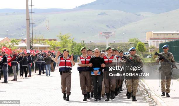 Protestors shout slogans and send rope as Turkish Gendarmerie escort defendants Akin Ozturk and others involved in last Julys attempted coup in...