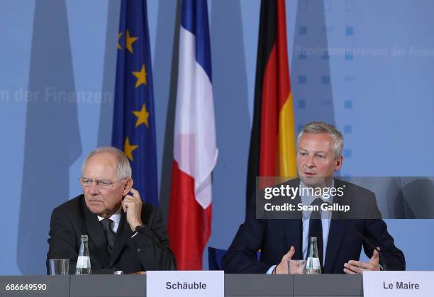 German Finance Minister Wolfgang Schaeuble and new French Finance Minister Bruno Le Maire speak to the media following talks on May 22, 2017 in...