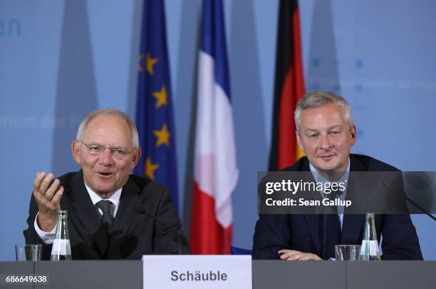 German Finance Minister Wolfgang Schaeuble and new French Finance Minister Bruno Le Maire speak to the media following talks on May 22, 2017 in...