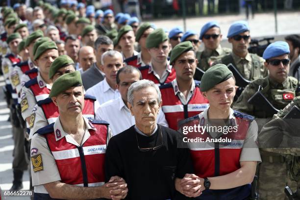 Turkish Gendarmerie escort defendants Akin Ozturk and others involved in last Julys attempted coup in Turkey as they leave the prison where they are...