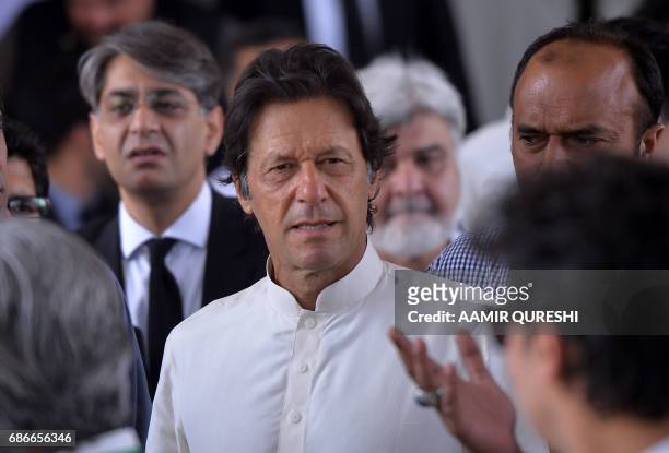 Pakistani opposition leader and head of the Pakistan Tehreek-i-Insaf party Imran Khan leaves the Supreme Court after attending a hearing on the...