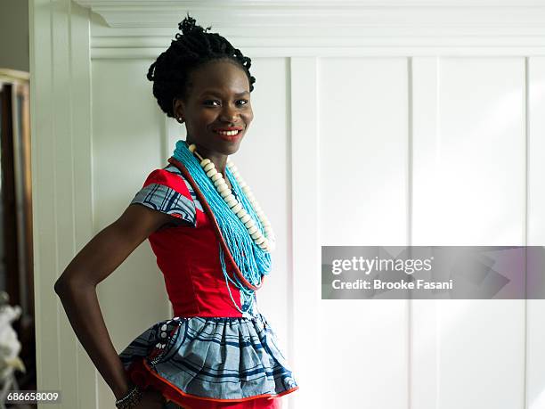 nigerian woman wearing african beads - brooke fasani stock pictures, royalty-free photos & images