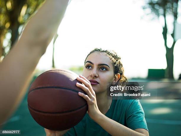 young moroccan woman playing ball - brooke fasani stock pictures, royalty-free photos & images