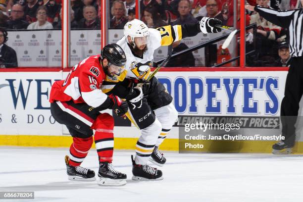 Clarke MacArthur of the Ottawa Senators battles for position against Nick Bonino of the Pittsburgh Penguins in Game Four of the Eastern Conference...