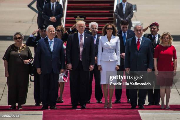 President Donald Trump and his wife Melania Trump standing surrunded by Israeli Prime Minister Benjamin Netanyahu and his wife Sara Netanyahu as...