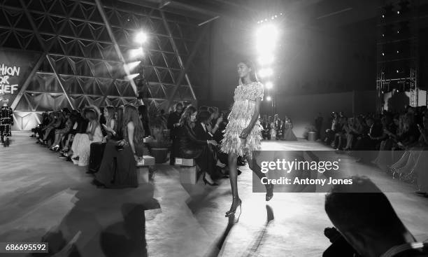 Naomi Campbell walks the runway at the Fashion for Relief event during the 70th annual Cannes Film Festival at Aeroport Cannes Mandelieu on May 21,...