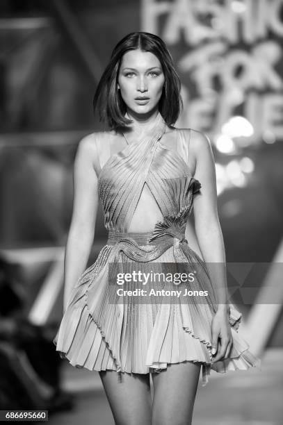 Bella Hadid walks the runway at the Fashion for Relief event during the 70th annual Cannes Film Festival at Aeroport Cannes Mandelieu on May 21, 2017...