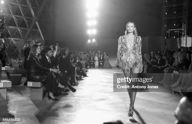 Kate Moss walks the runway at the Fashion for Relief event during the 70th annual Cannes Film Festival at Aeroport Cannes Mandelieu on May 21, 2017...