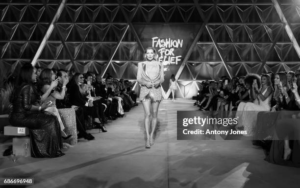 Kate Moss walks the runway at the Fashion for Relief event during the 70th annual Cannes Film Festival at Aeroport Cannes Mandelieu on May 21, 2017...