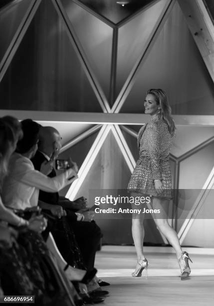 Kate Moss walks the runway at the Fashion for Relief event during the 70th annual Cannes Film Festival at Aeroport Cannes Mandelieu on May 21, 2017...