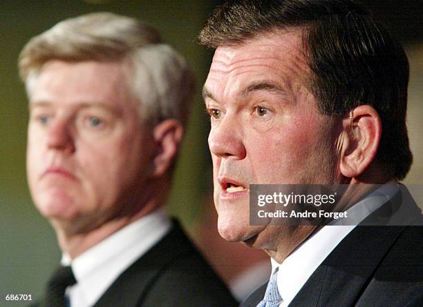 Homeland Security Director Tom Ridge answers questions from reporters as Canadian Foreign Minister John Manley looks on December 11, 2001 in the...