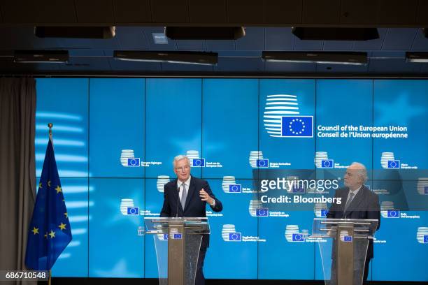 Michel Barnier, chief negotiator for the European Union , left, speaks as Louis Grech, Malta's deputy prime minister, looks on during a news...