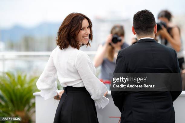 Actors Aure Atika and Karim Moussaoui attend the "Waiting For Swallows " photocall during the 70th annual Cannes Film Festival at Palais des...