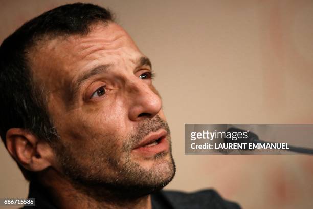 French actor Mathieu Kassovitz talks on May 22, 2017 during a press conference for the film 'Happy End' at the 70th edition of the Cannes Film...