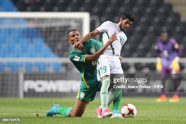 Fahad Alrashidi of Saudi Arabia and Waly Diouf of Senegal compete for the ball during the FIFA U-20 World Cup Korea Republic 2017 group F match...