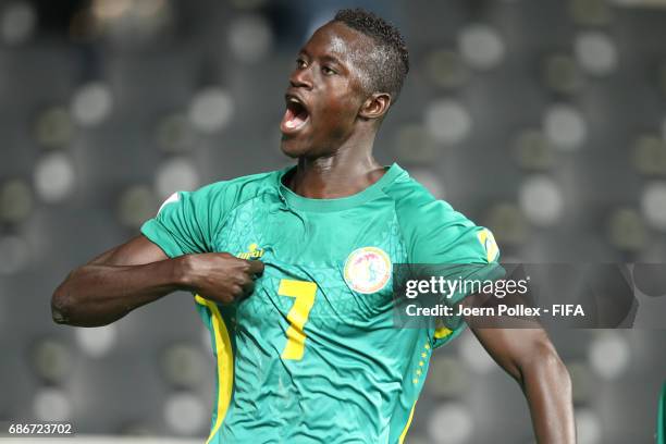 Ibrahima Niane of Senegal celebrates with his team mates after scoring his team's first goal of Senegal compete for the ball during the FIFA U-20...