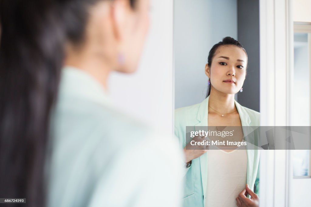 A business woman preparing for work, waking up and dressing.