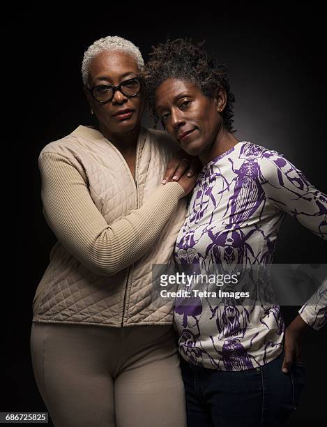 Portrait of two women standing in embrace