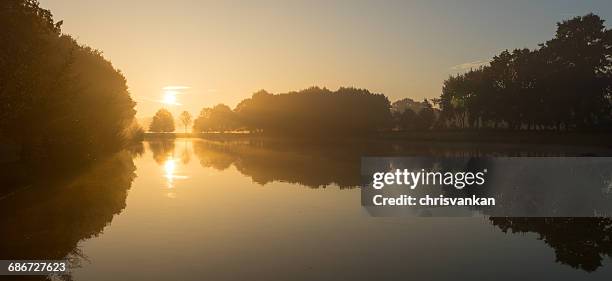 sunrise over river, enschede, overijssel, netherlands - chrisvankan stock pictures, royalty-free photos & images