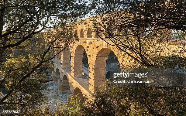 pont du gard aqueduct over  gardon river, france - chrisvankan stock pictures, royalty-free photos & images