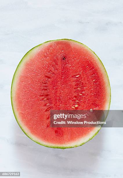 watermelon cut in half - cut in half ストックフォトと画像