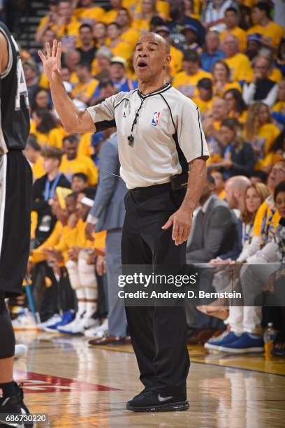 Referee, Dan Crawford calls a foul in Game One of the Western Conference Finals between the San Antonio Spurs and the Golden State Warriors during...