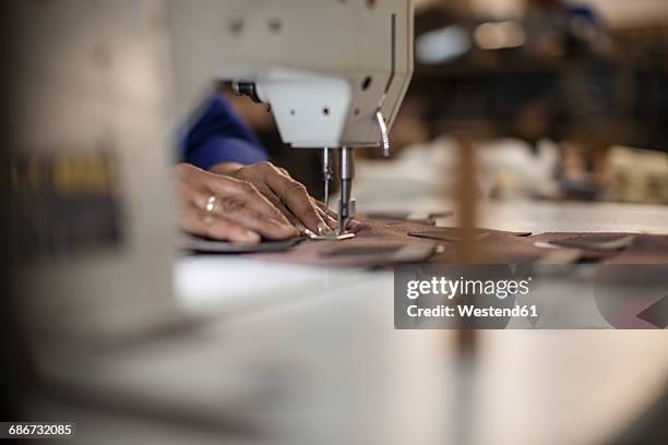 seamstress working with sewing machine - sewing machine stock-fotos und bilder