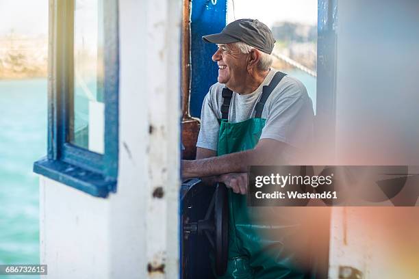 fisherman working on trawler - fiskeindustri bildbanksfoton och bilder