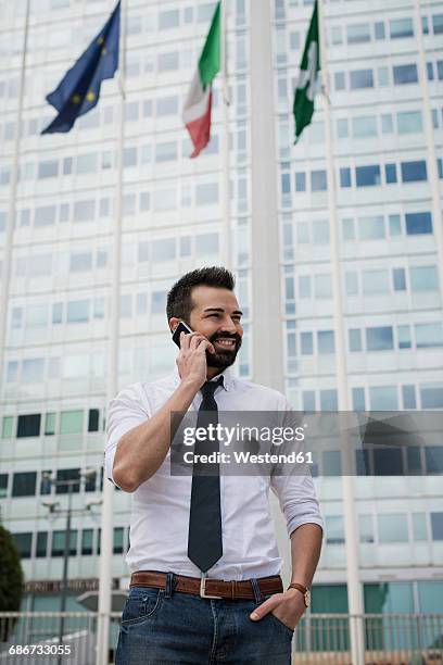 smiling businessman on the phone - all european flags stock pictures, royalty-free photos & images