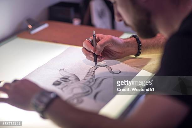graphic artist sketching - south african people stock illustrations