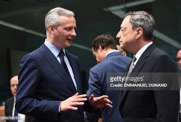 France's new Economy Minister Bruno Le Maire speaks to European Central Bank President Mario Draghi during a Eurogroup finance ministers meeting on...