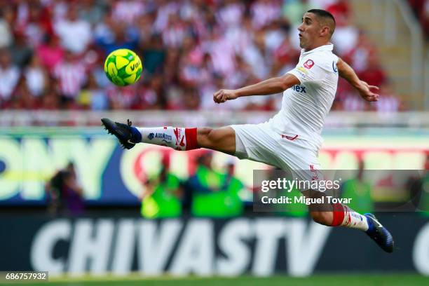 Osvaldo Gonzalez of Toluca jumps to control the ball during the semi final second leg match between Chivas and Toluca as part of the Torneo Clausura...