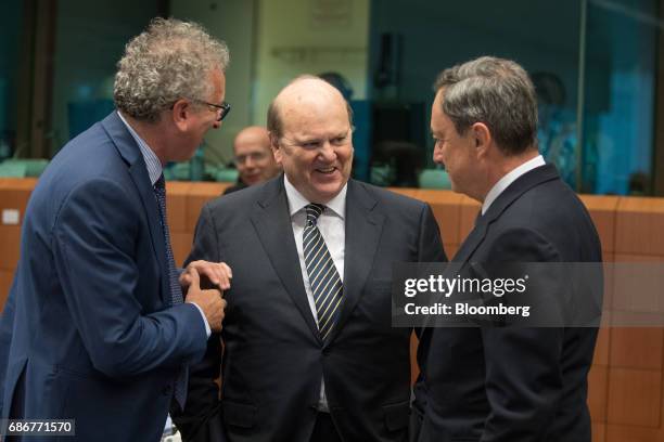 Michael Noonan. Ireland's finance minister, center, speaks with Mario Draghi, president of the European Central Bank , right, and Pierre Gramegna,...