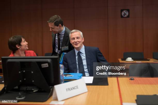 Bruno Le Maire, France's finance minister, center, takes his seat ahead of a Eurogroup meeting of European finance ministers in Brussels, Belgium, on...